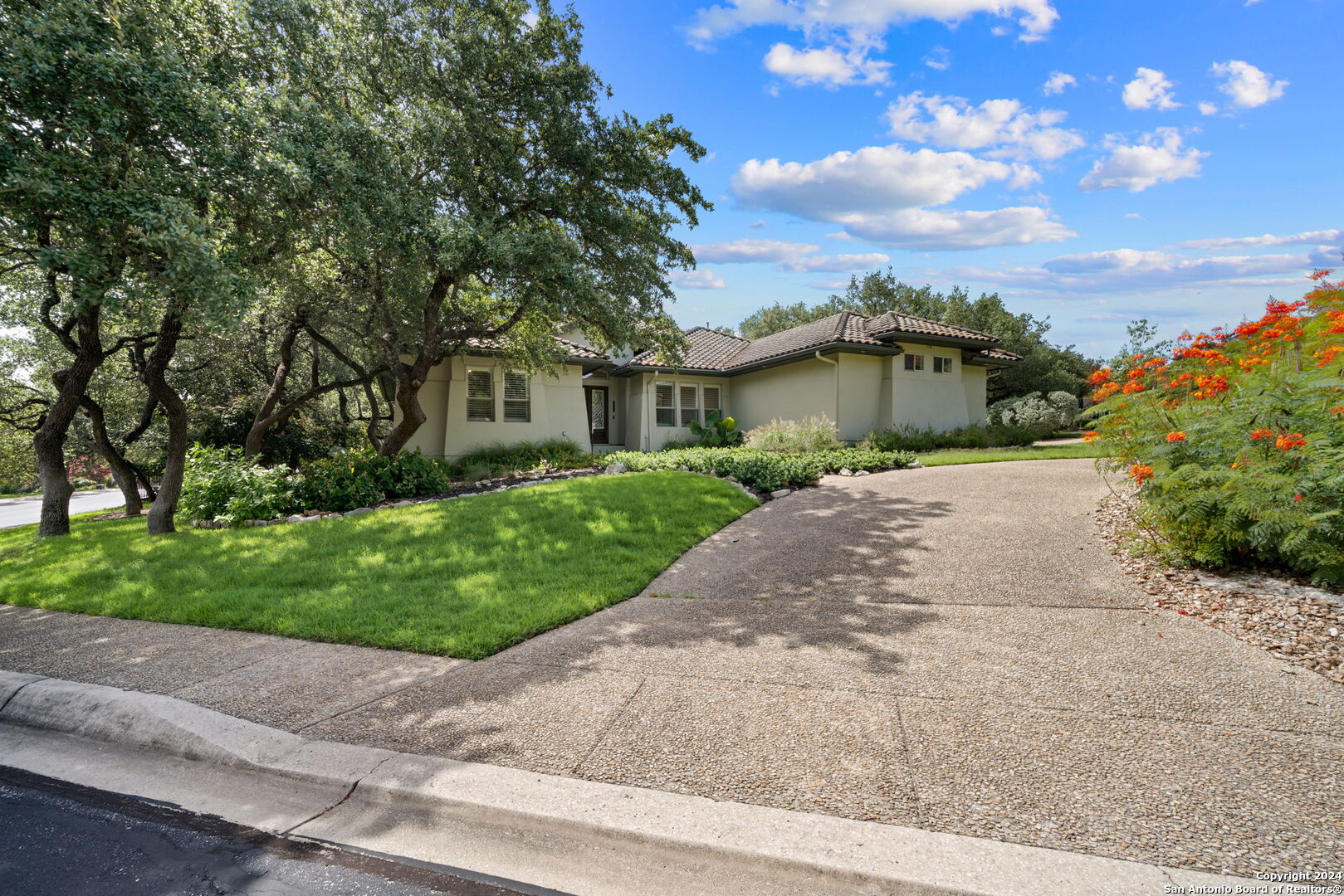 front view of a house with a garden