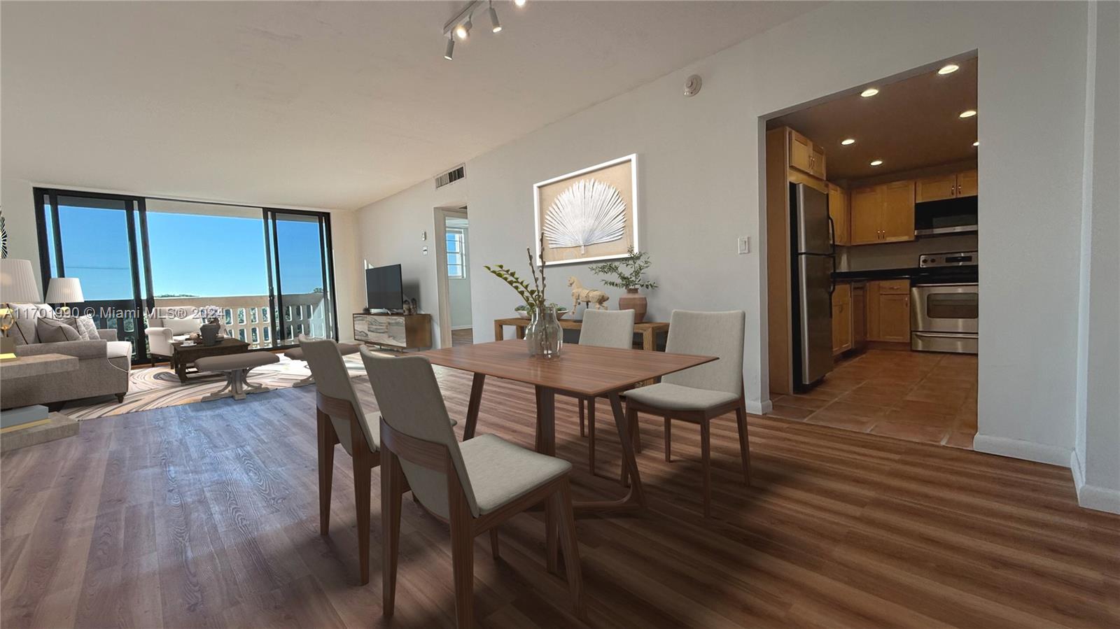 a view of a dining room with furniture and wooden floor