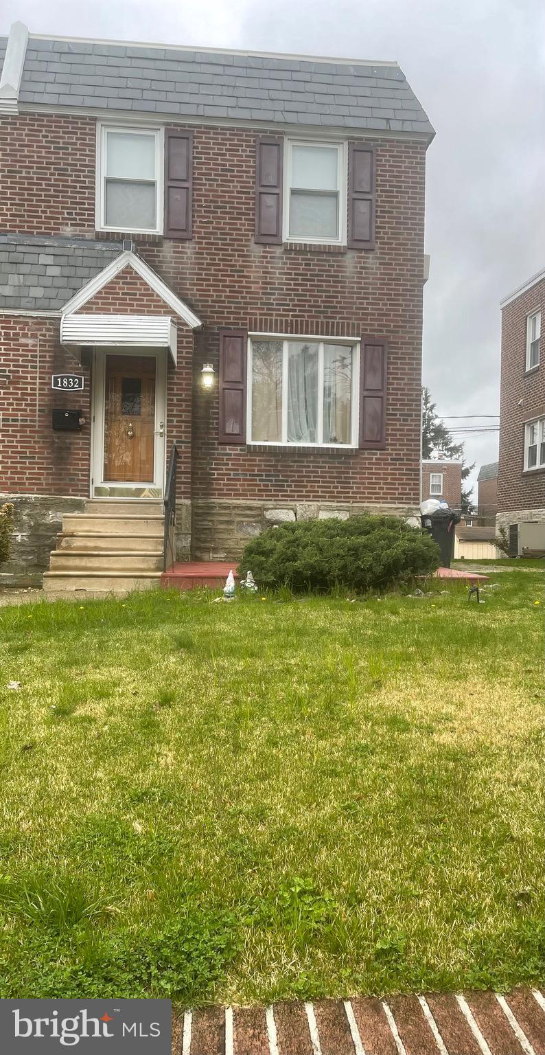 a front view of a house with a yard