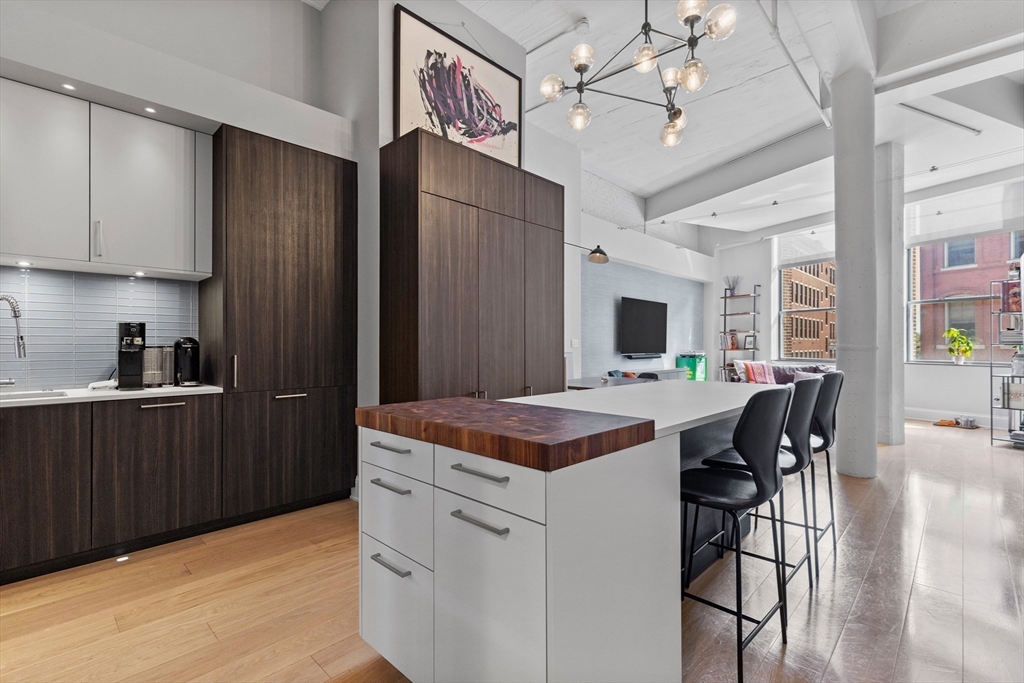 a kitchen that has a cabinets and a stove in it