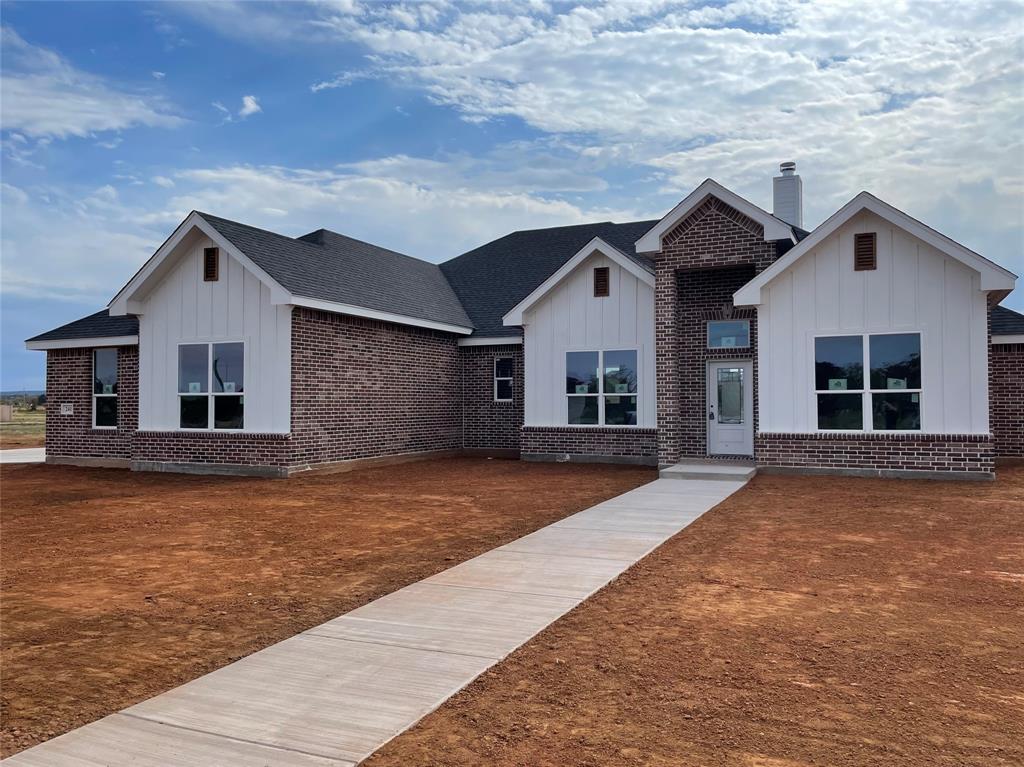 a front view of a house with yard