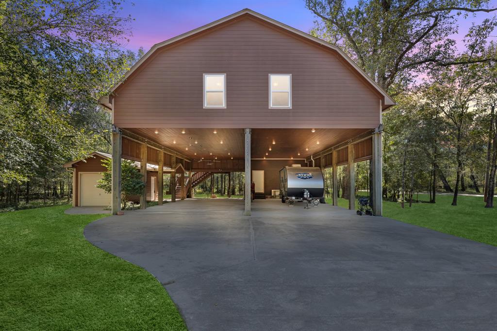 a view of a house with a yard and sitting area