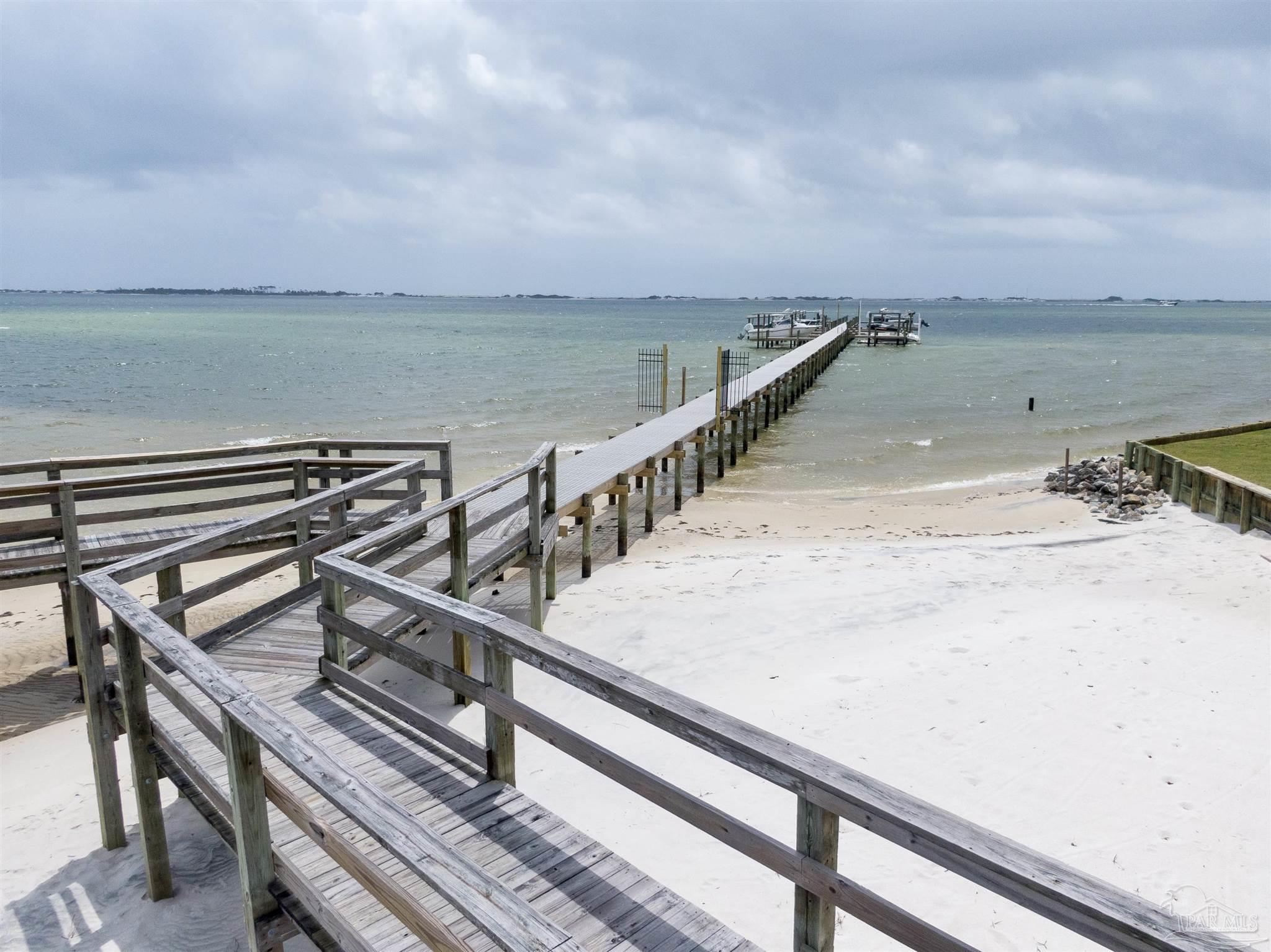 a view of wooden deck with ocean view