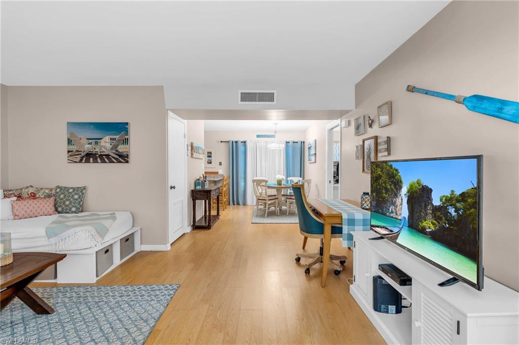 a view of a livingroom with furniture and a flat screen tv