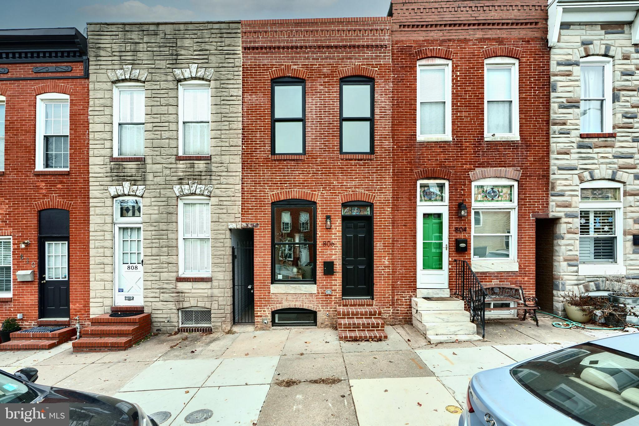 a front view of a brick building with many windows