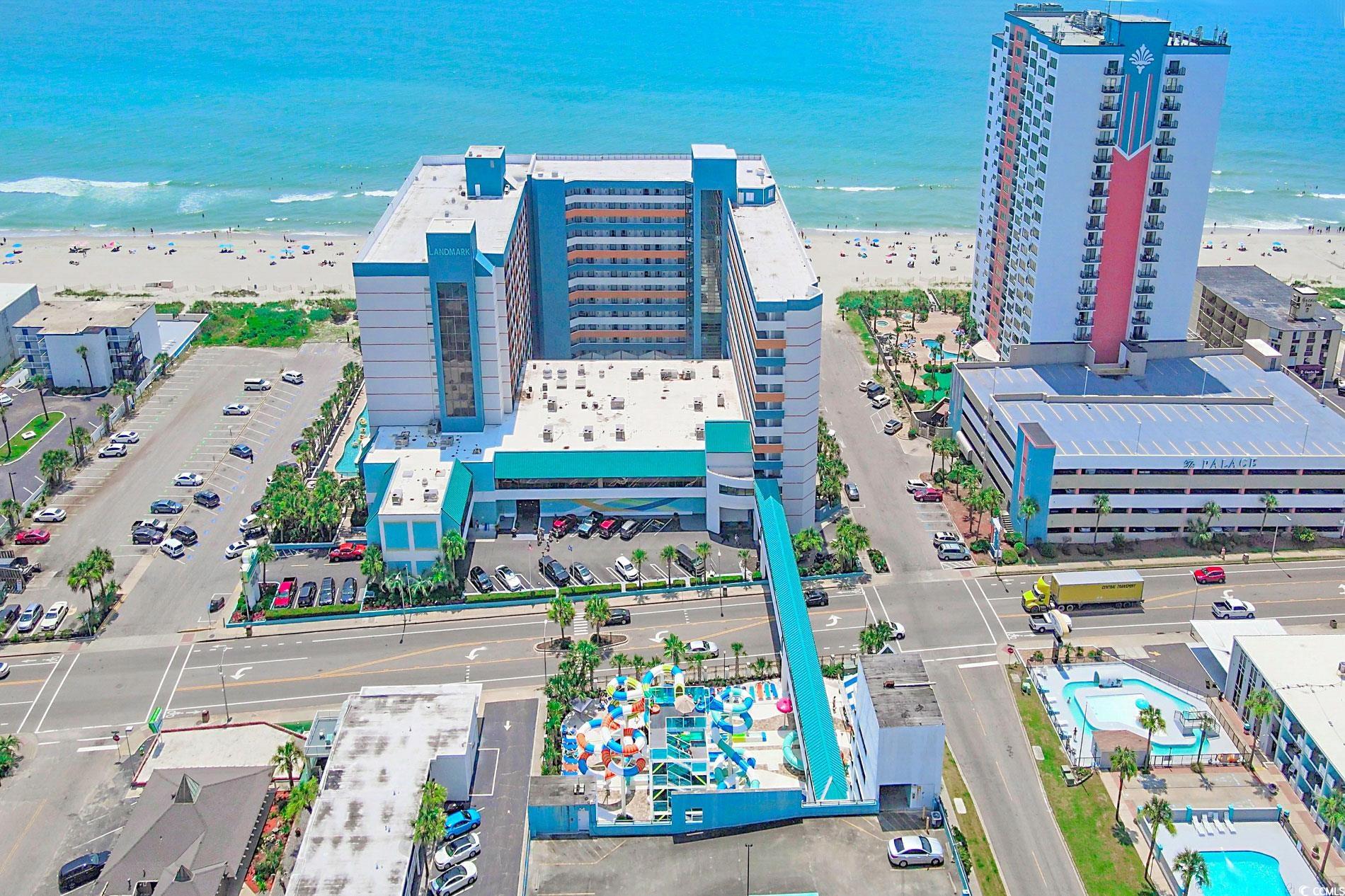 Aerial view featuring a beach view and a water vie