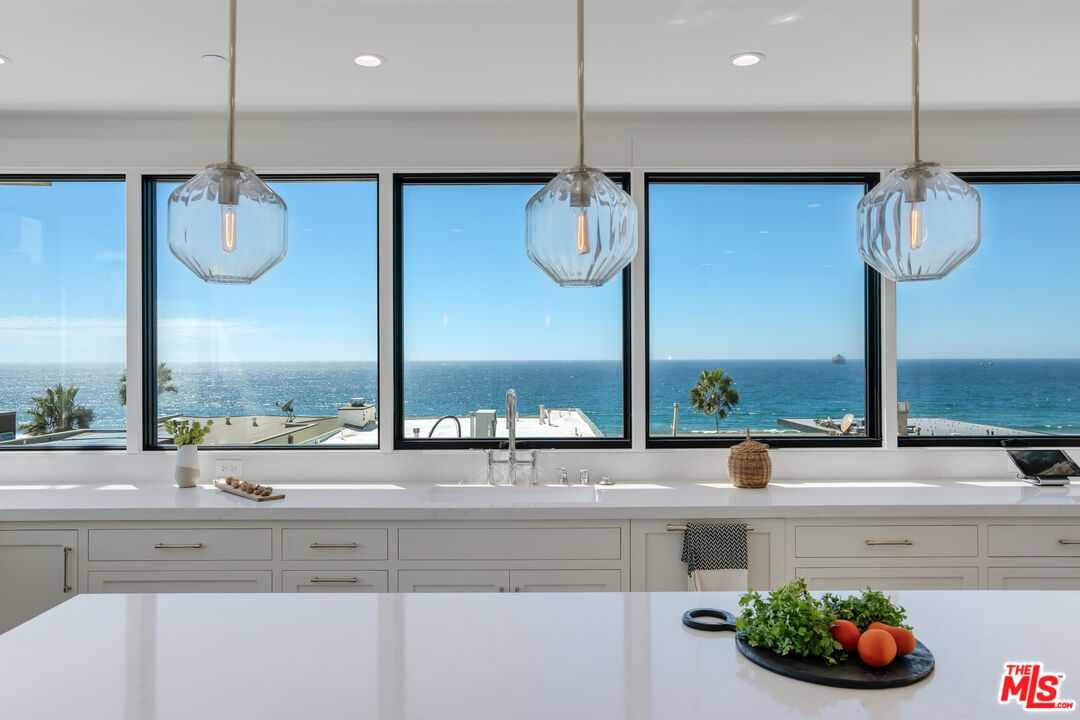 a kitchen with a table and chairs