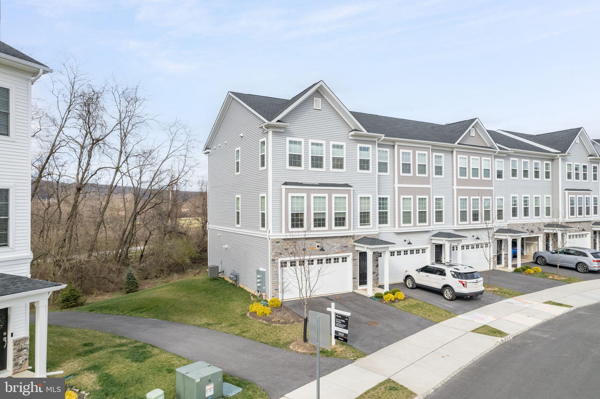 a view of a building with cars parked