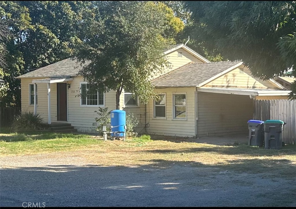 a view of house with yard