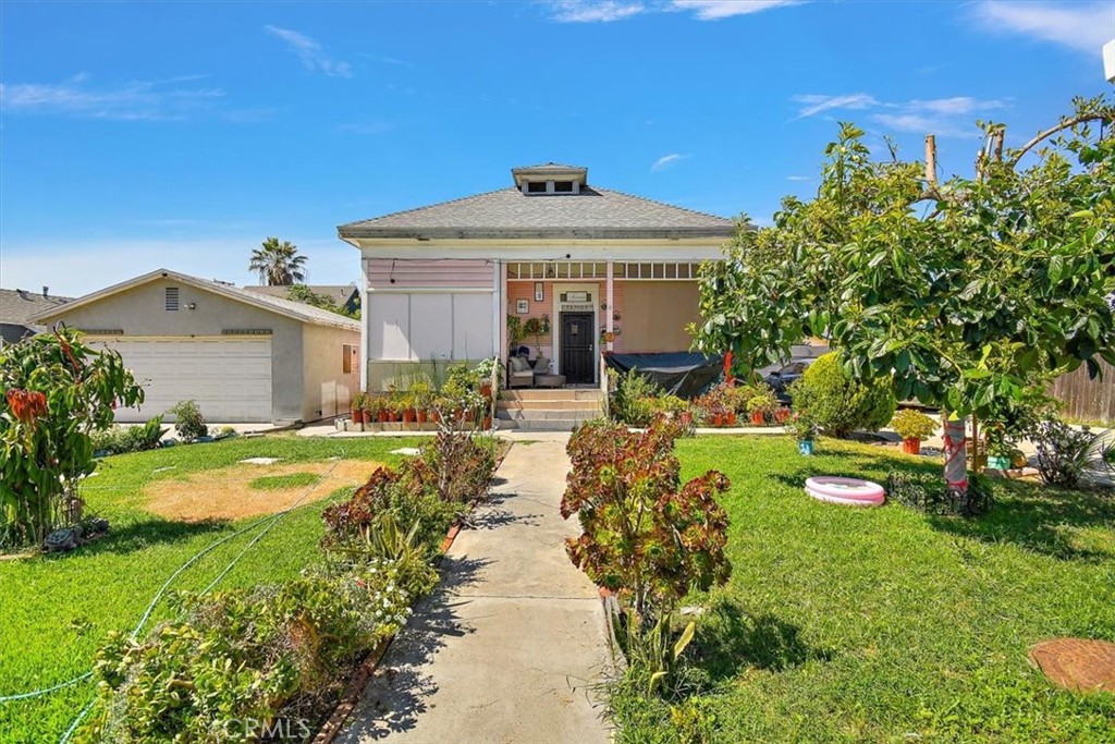 a front view of a house with garden