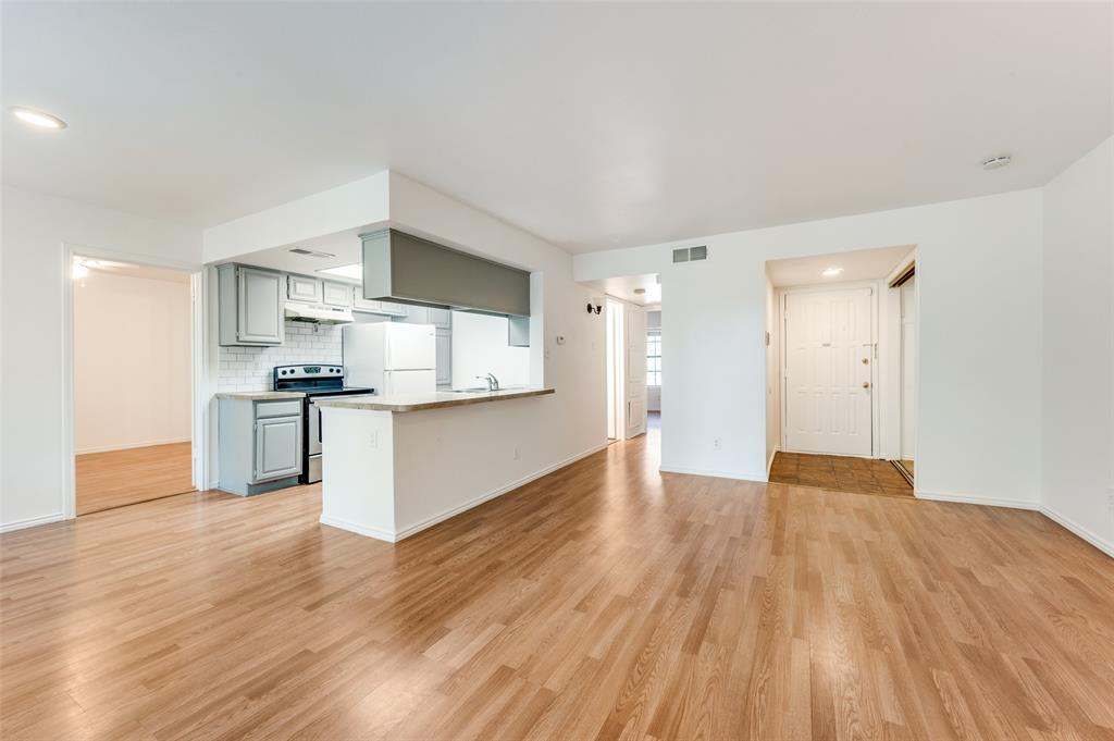 a view of kitchen with wooden floor