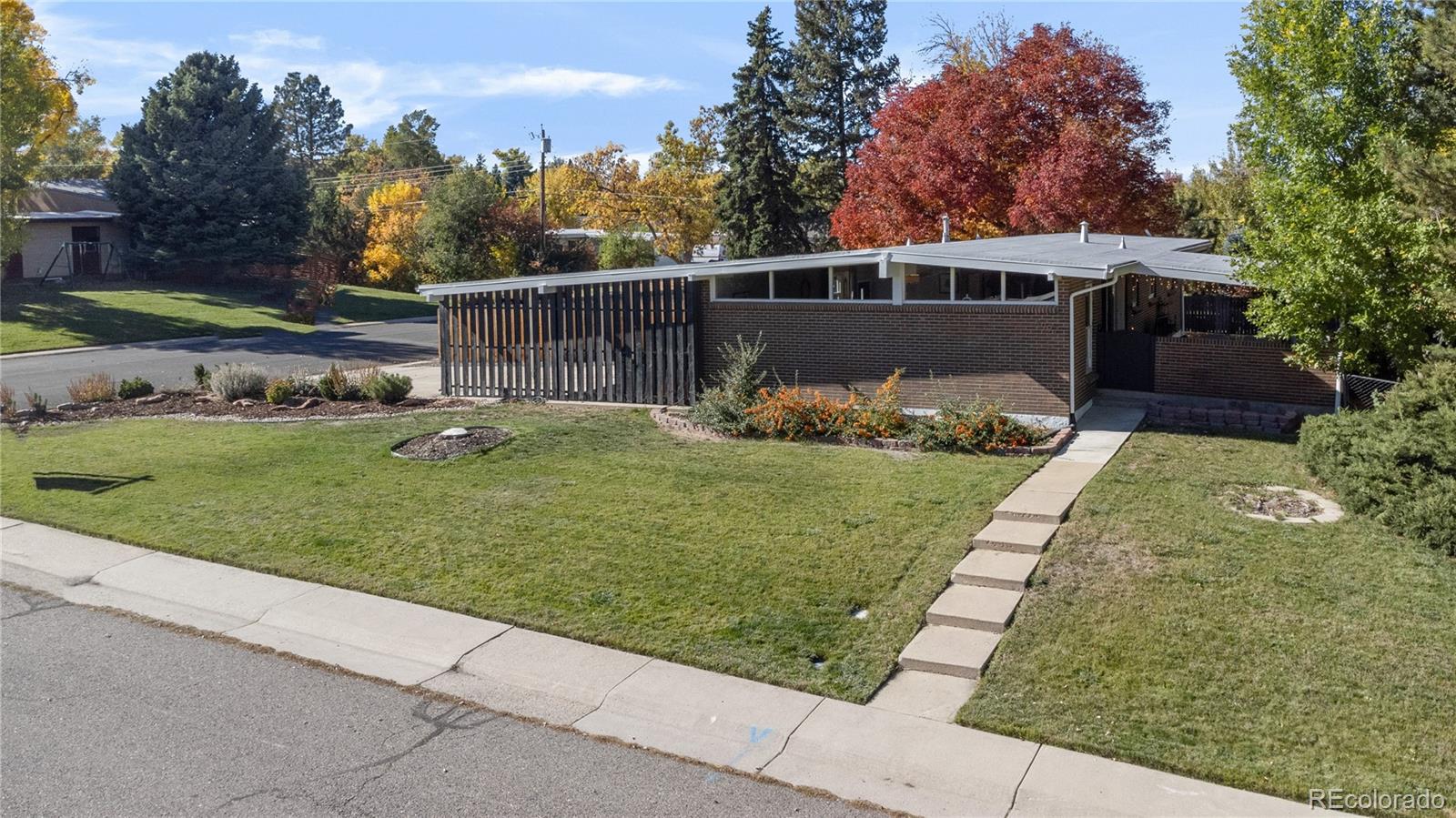 a view of a backyard with sitting area