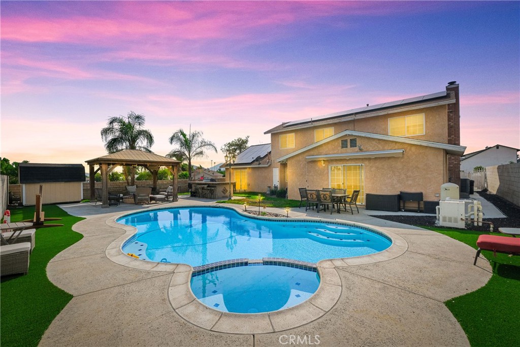 a view of a swimming pool with a patio