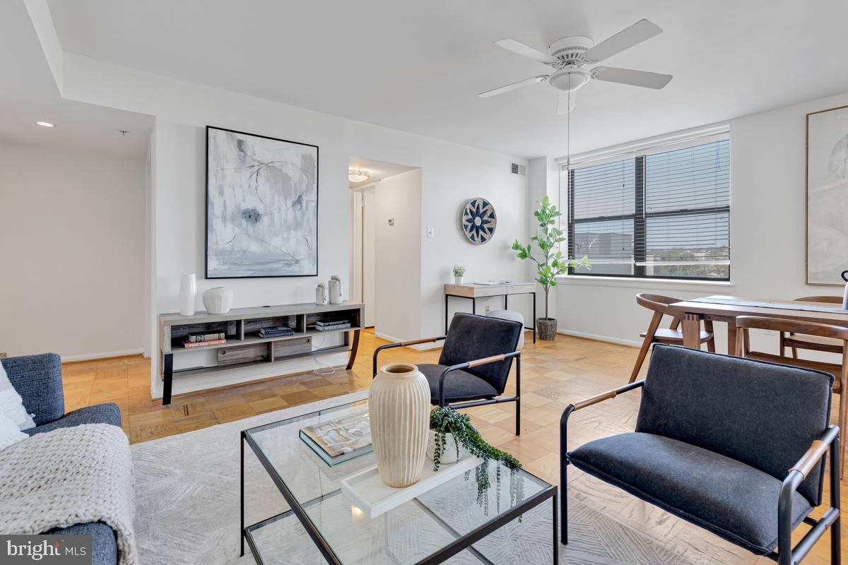 a living room with furniture and a window