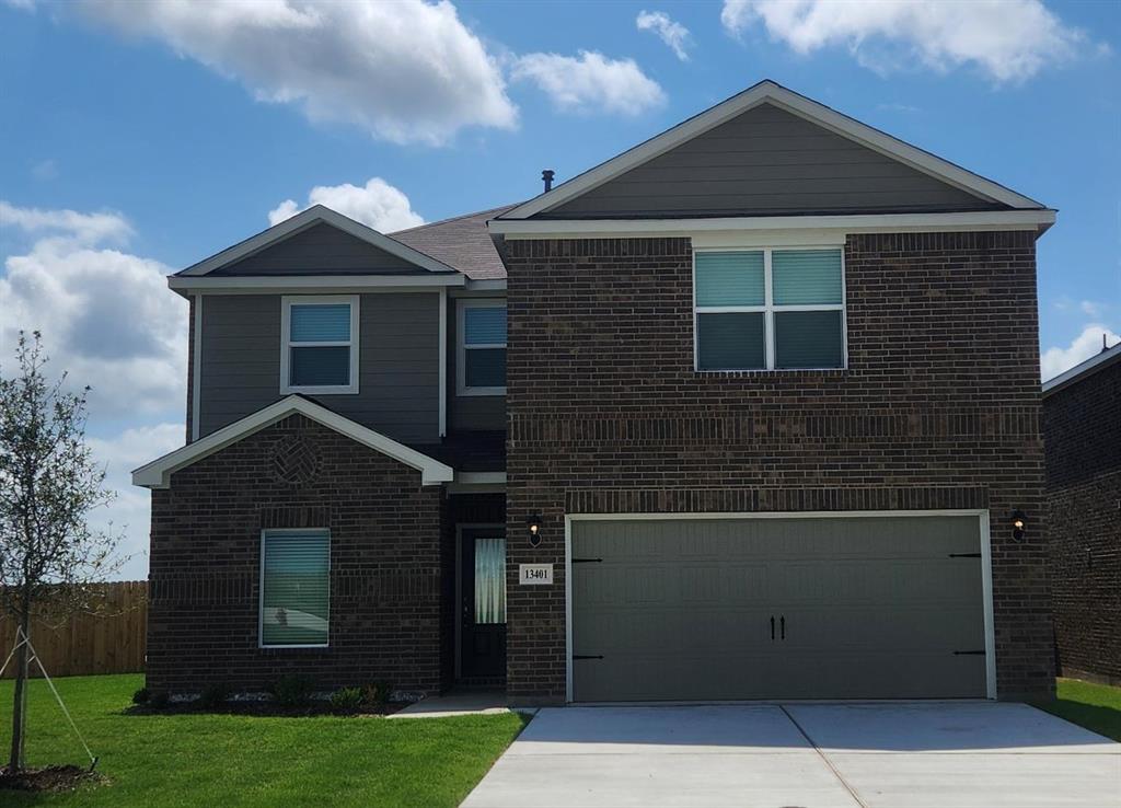 a front view of a house with yard