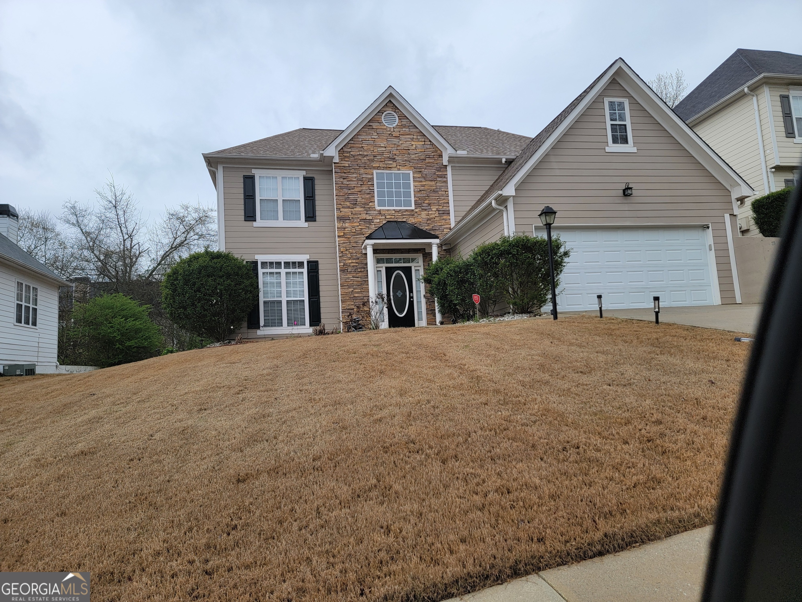 a front view of a house with a yard