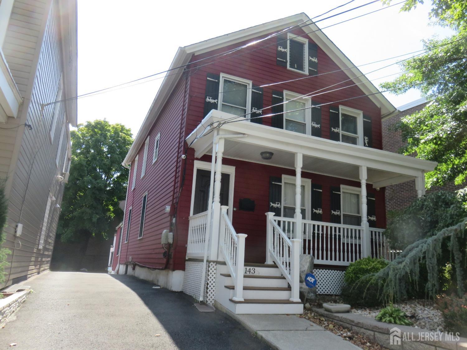 a front view of a house with a porch