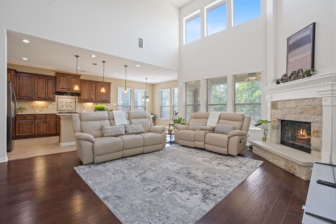 a living room with furniture and a fireplace