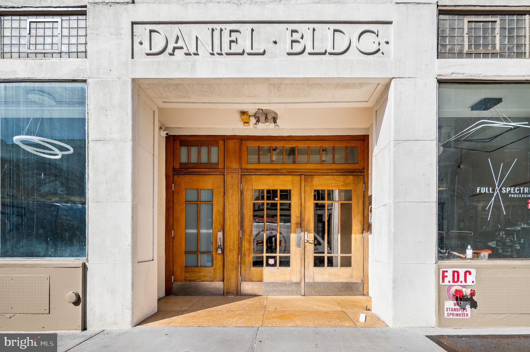 a front view of a building with retail shops