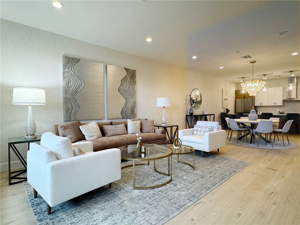 a living room with furniture and a lamp