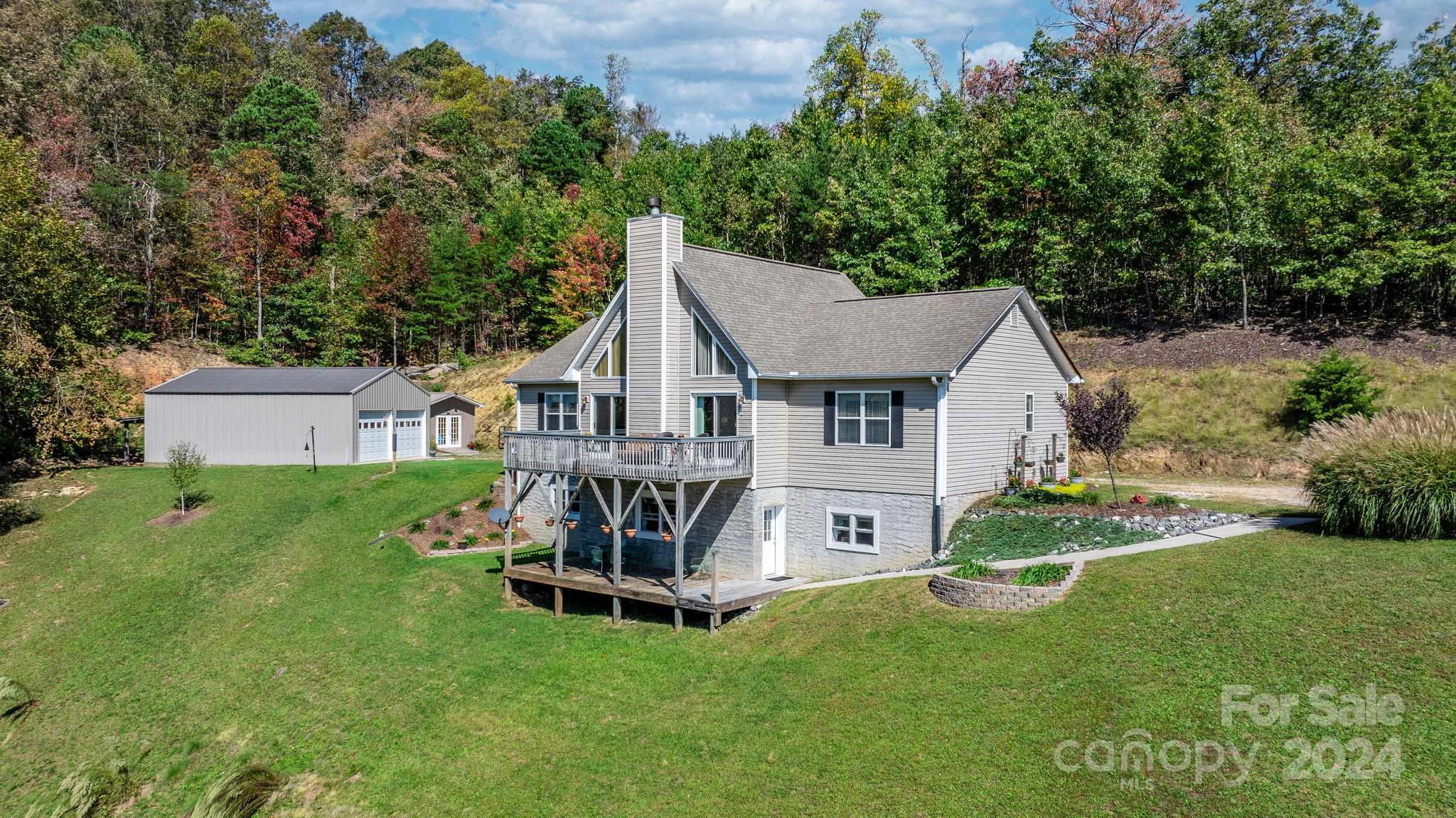 a view of a house with a yard porch and sitting area