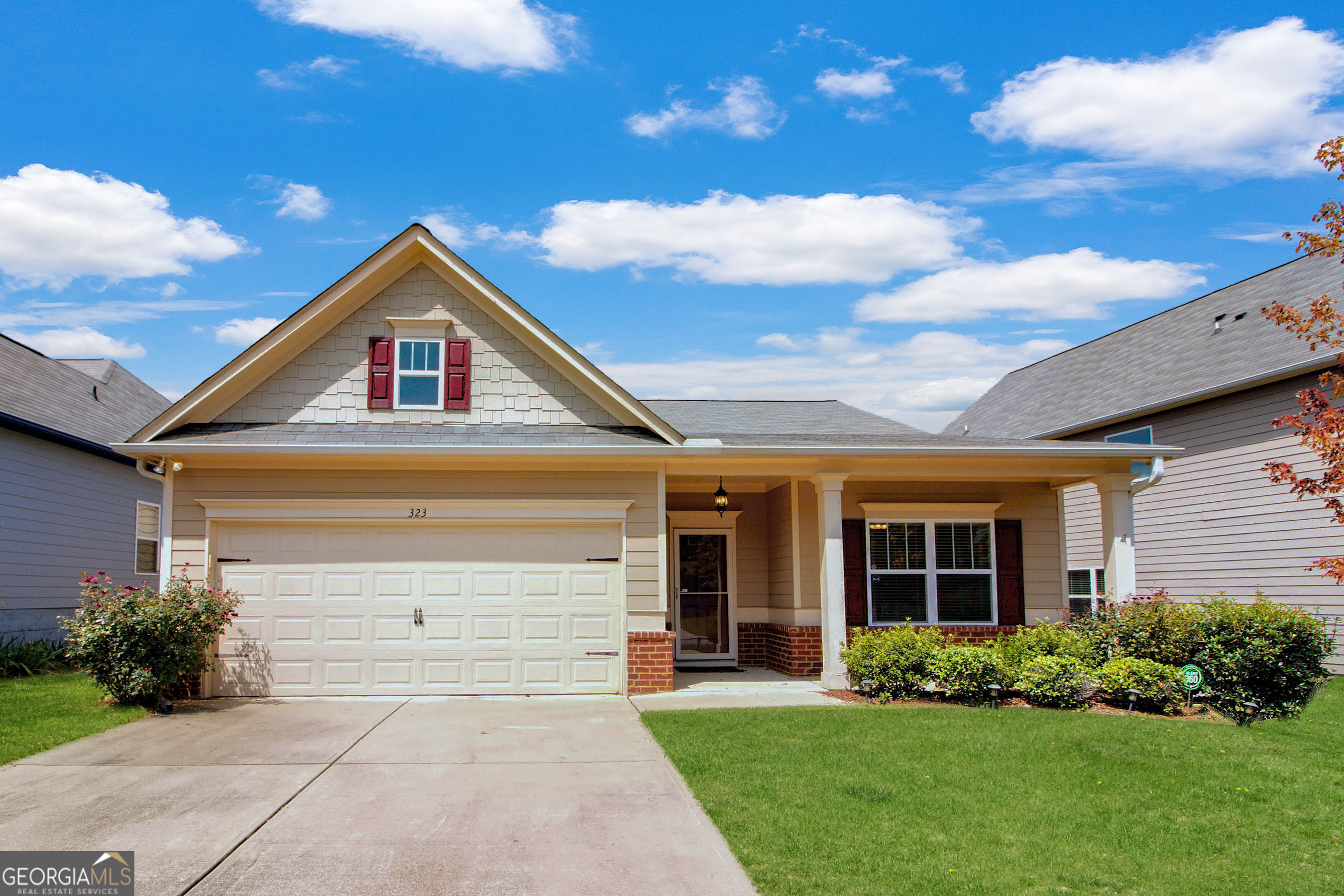 front view of a house with a yard