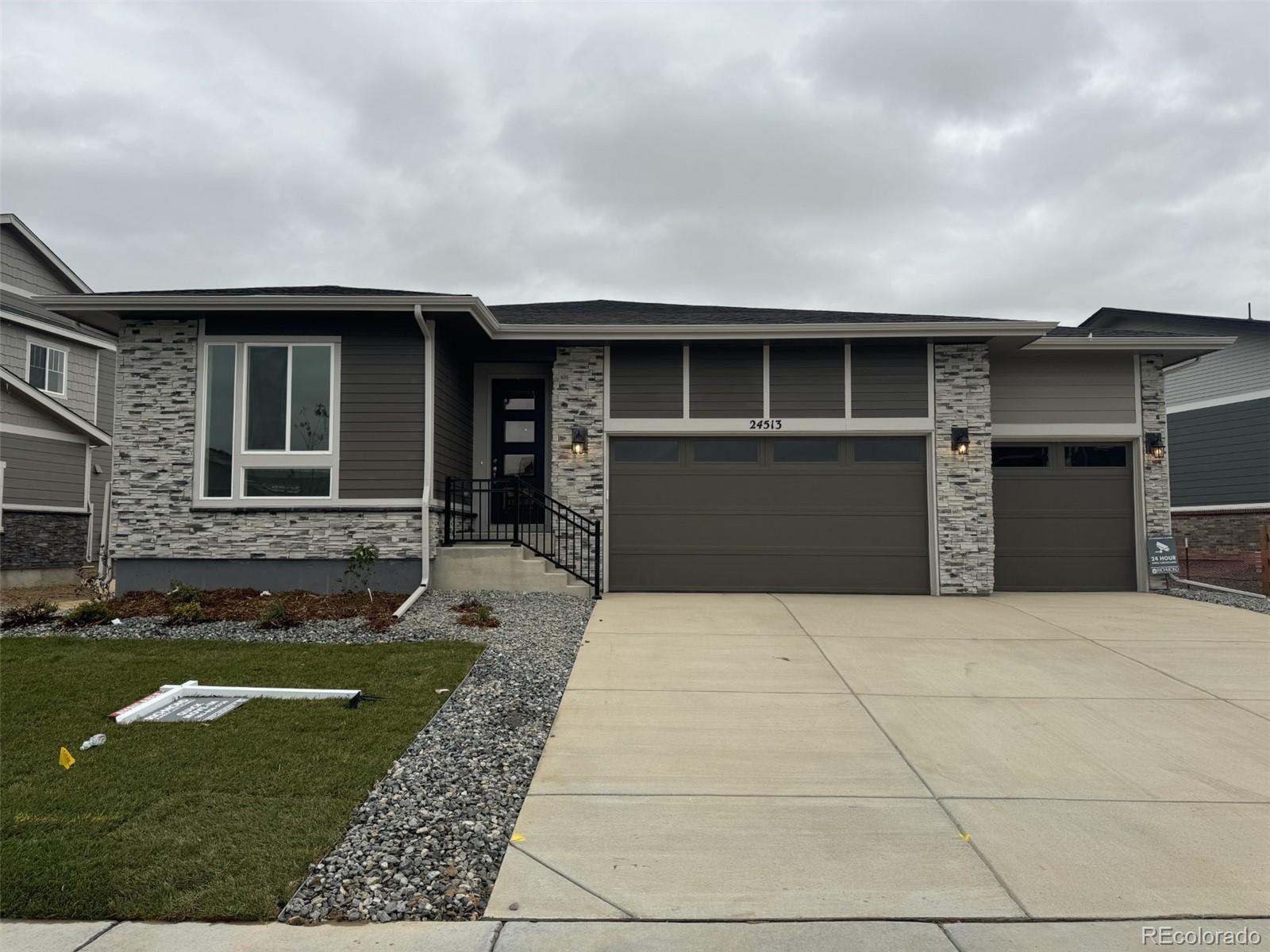 a front view of a house with yard