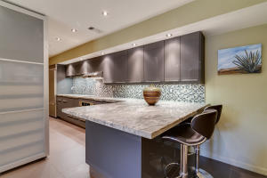 a kitchen with a table and cabinets