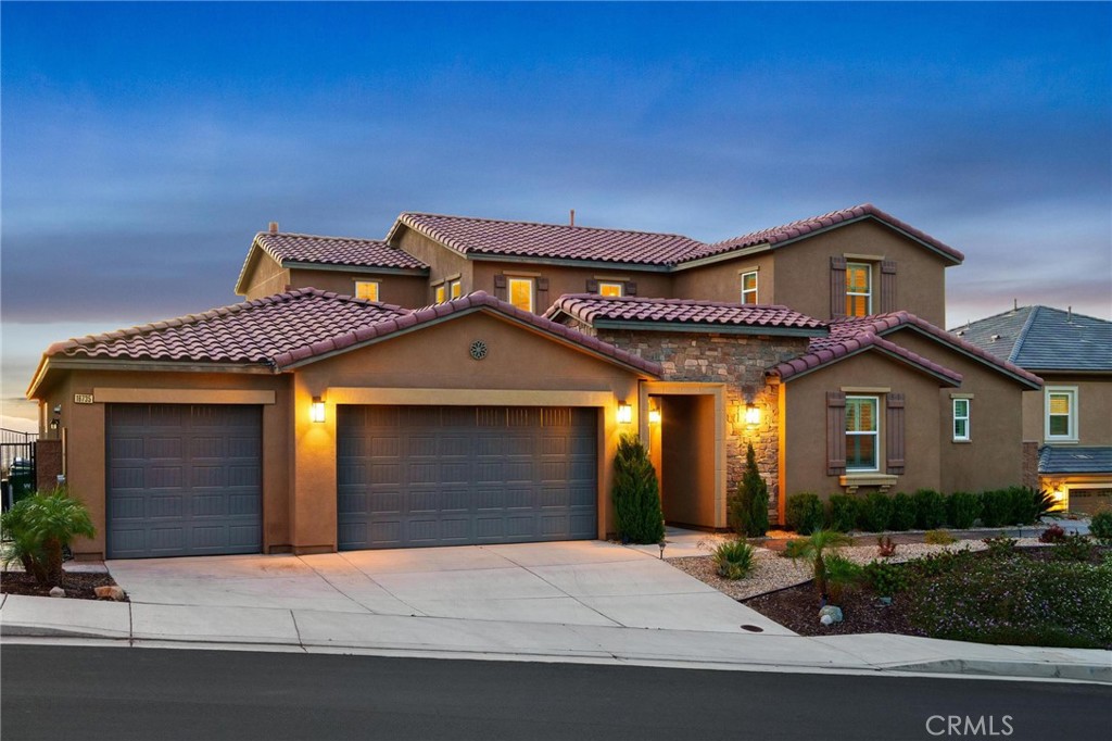 a front view of a house with yard