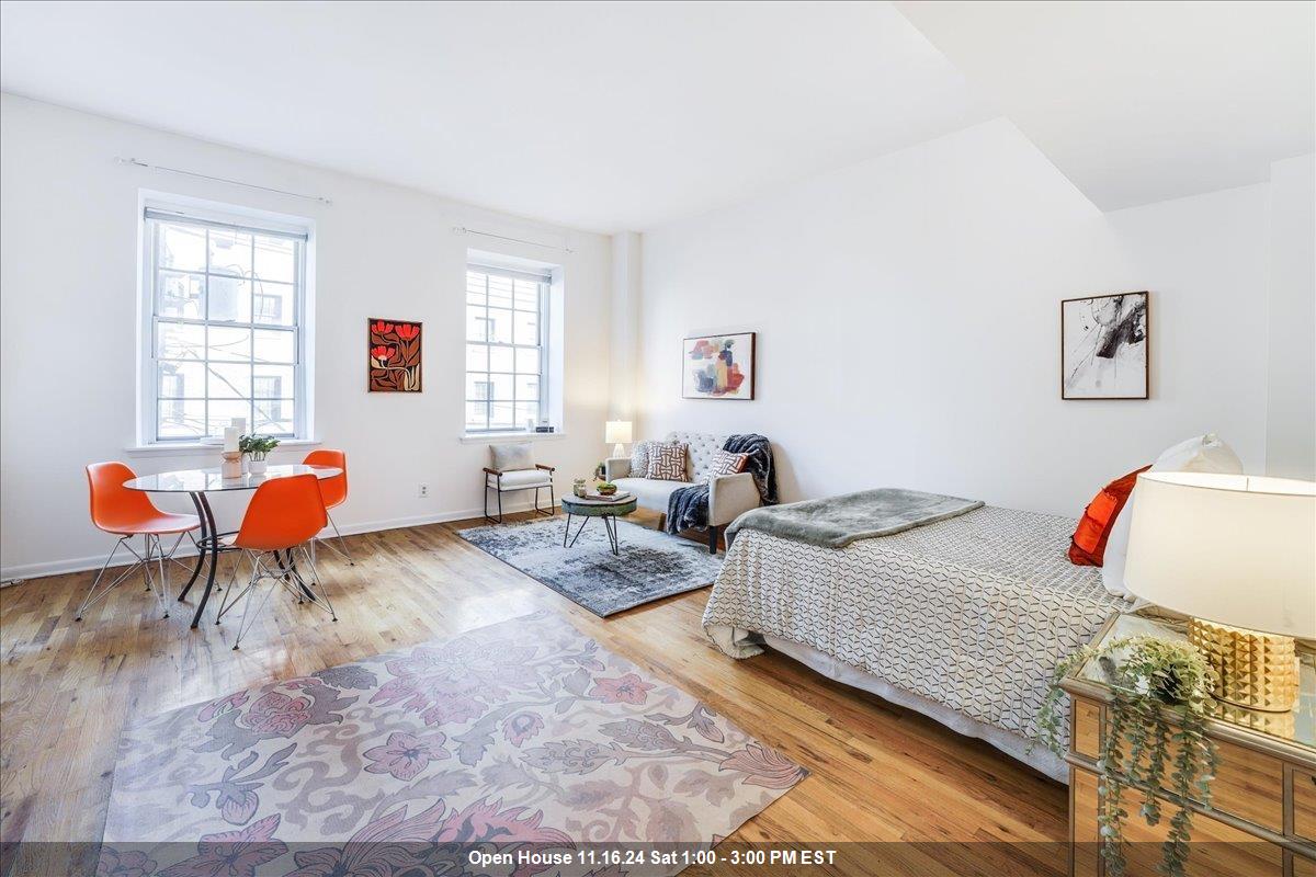 a bedroom with bed and a window