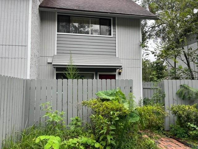 a view of a house with a small yard and plants