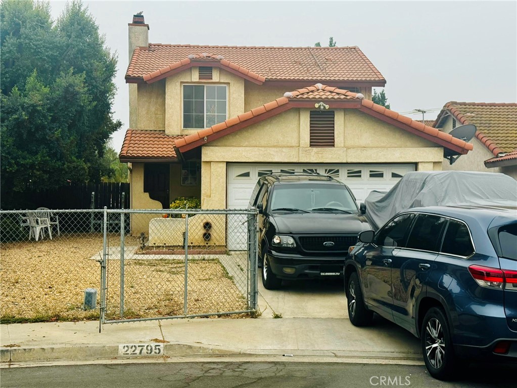 a front view of a house with parking space