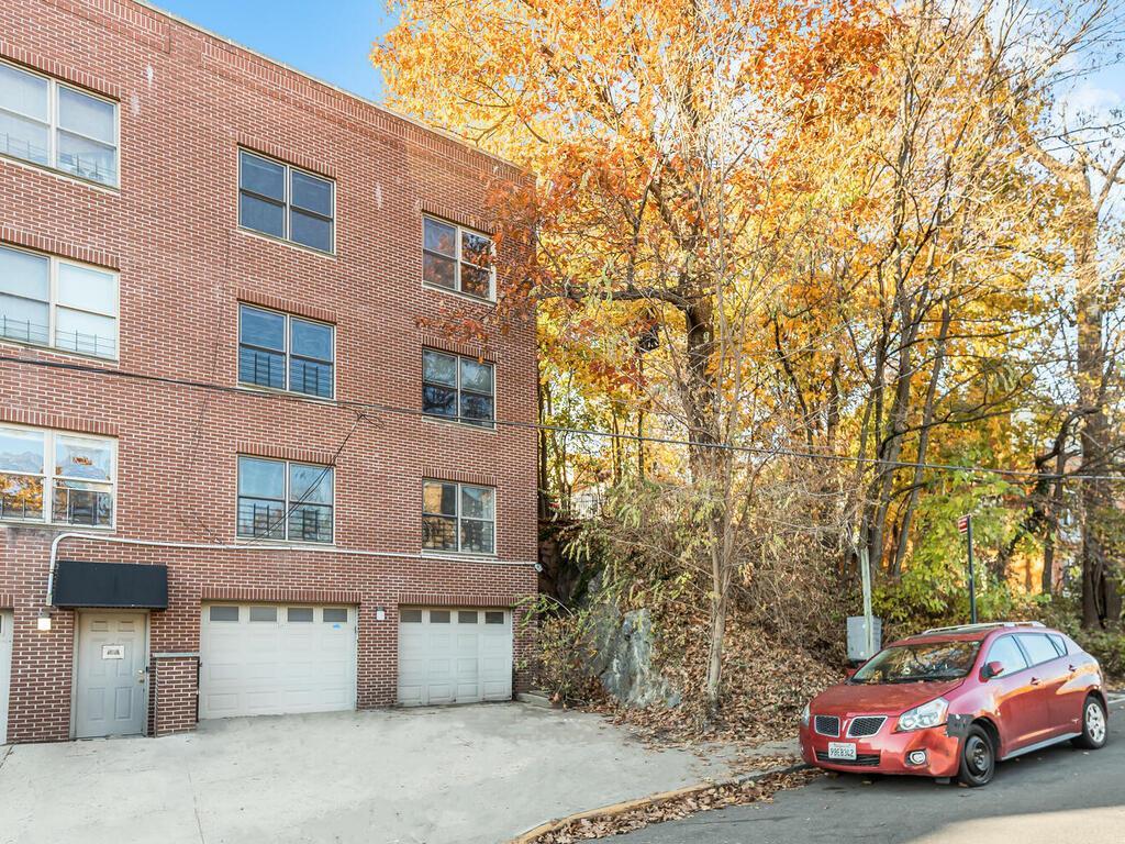 View of building exterior featuring a garage