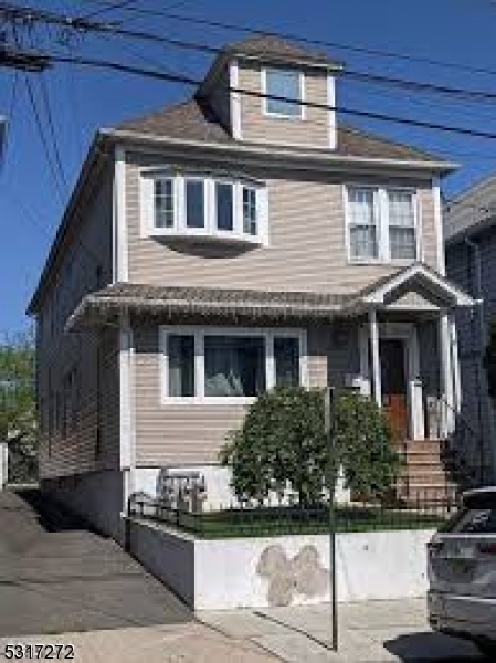 a front view of a house with stairs