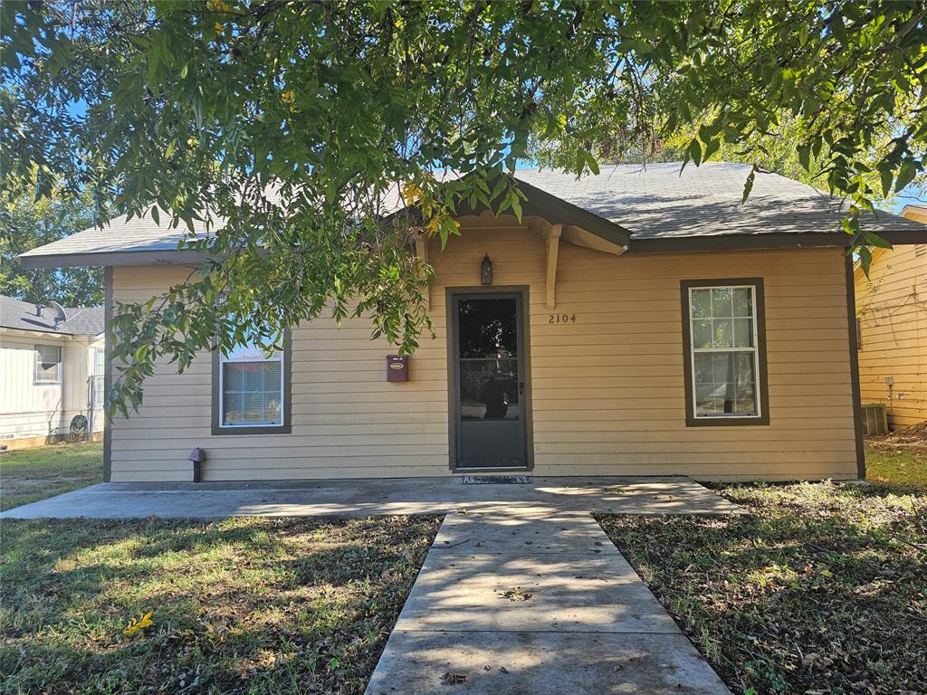 a front view of a house with yard