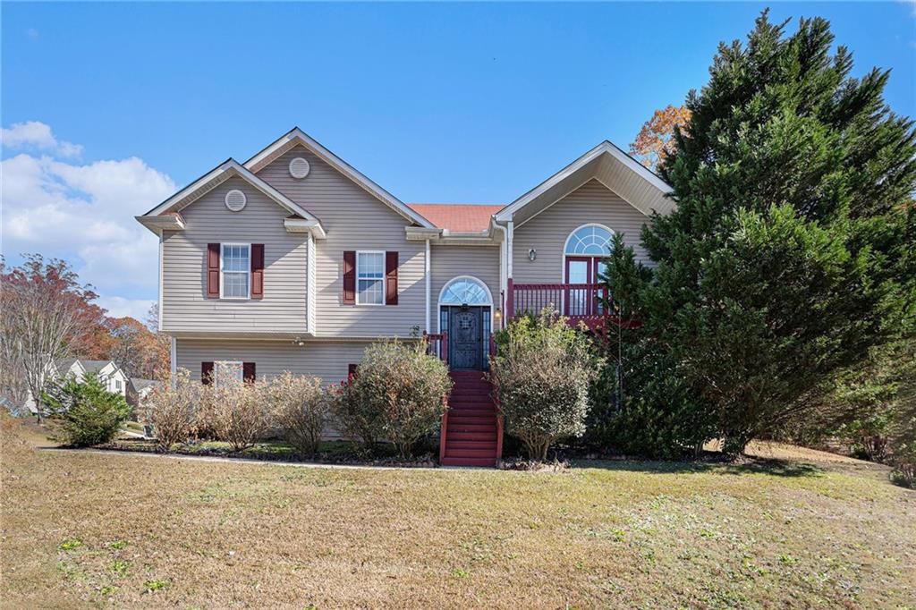 a front view of a house with a yard