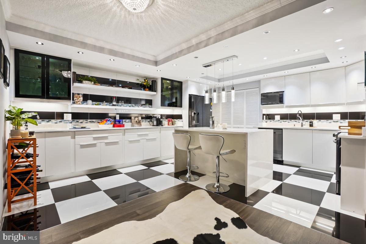 a room with a white cabinets and appliances