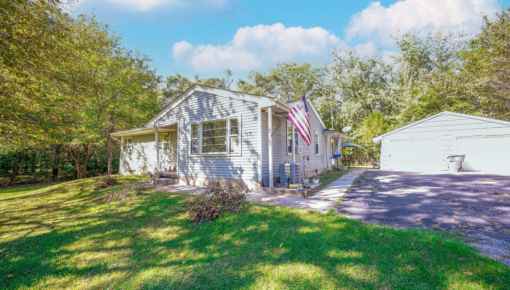 a view of a house with a yard