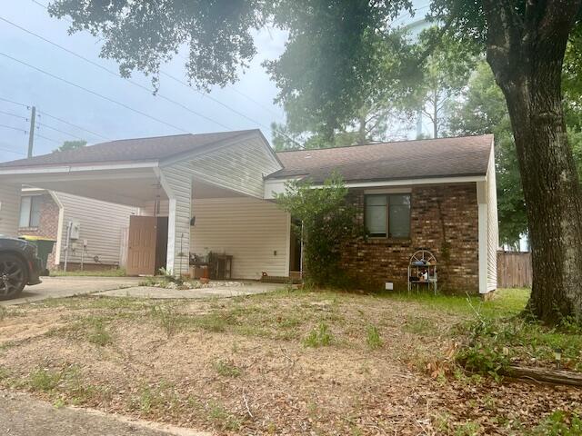 a view of a house with a yard and garage