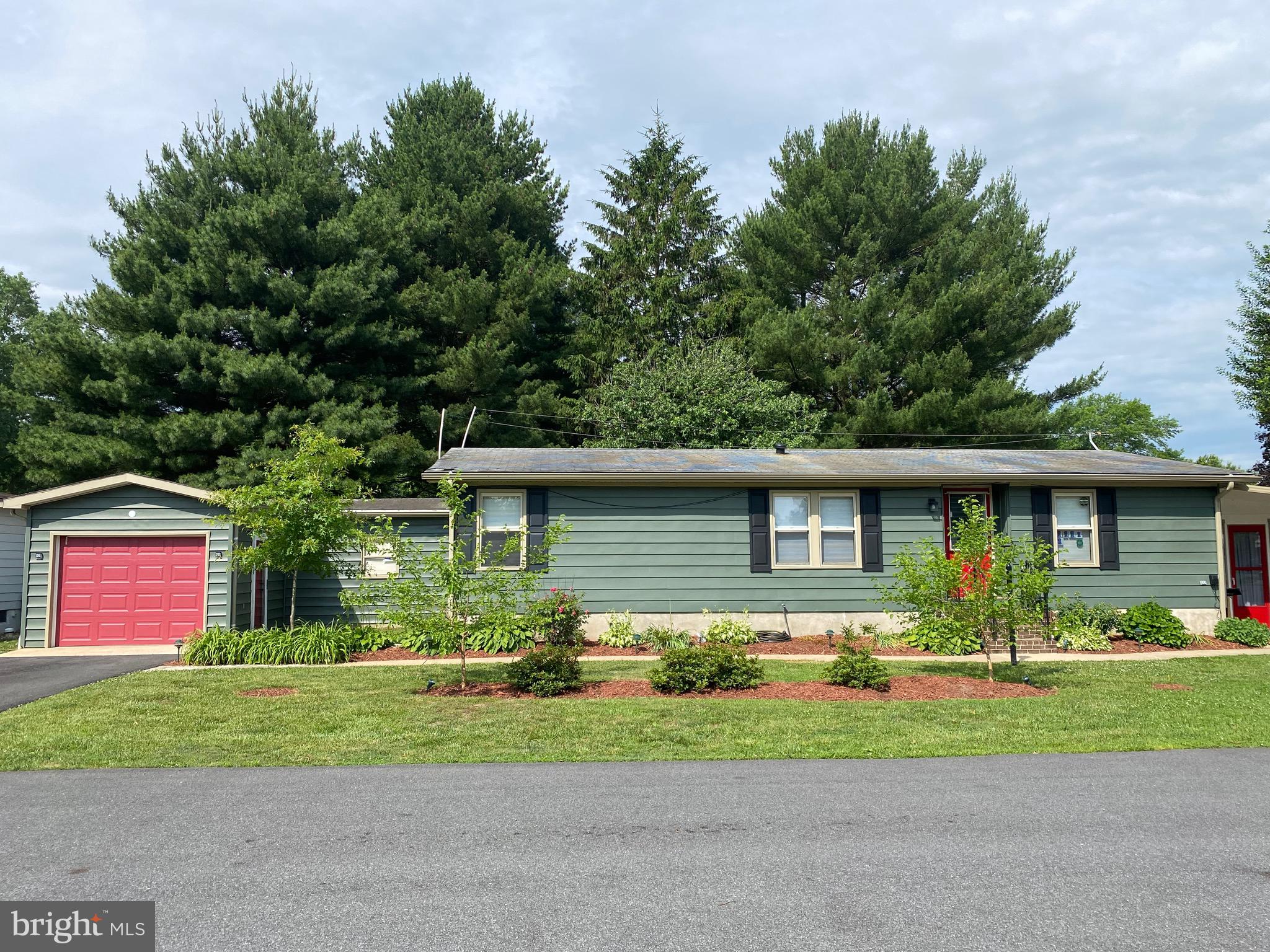 front view of a house with a yard