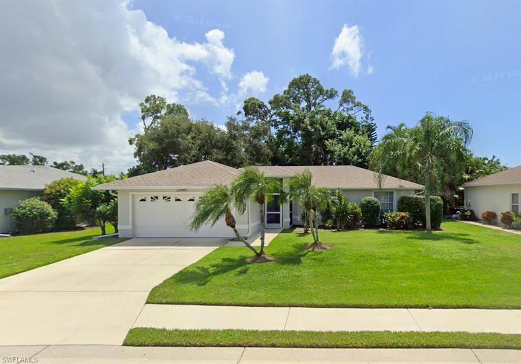 a view of a house with a yard