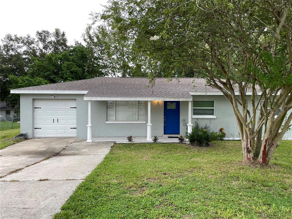 front view of a house with a yard