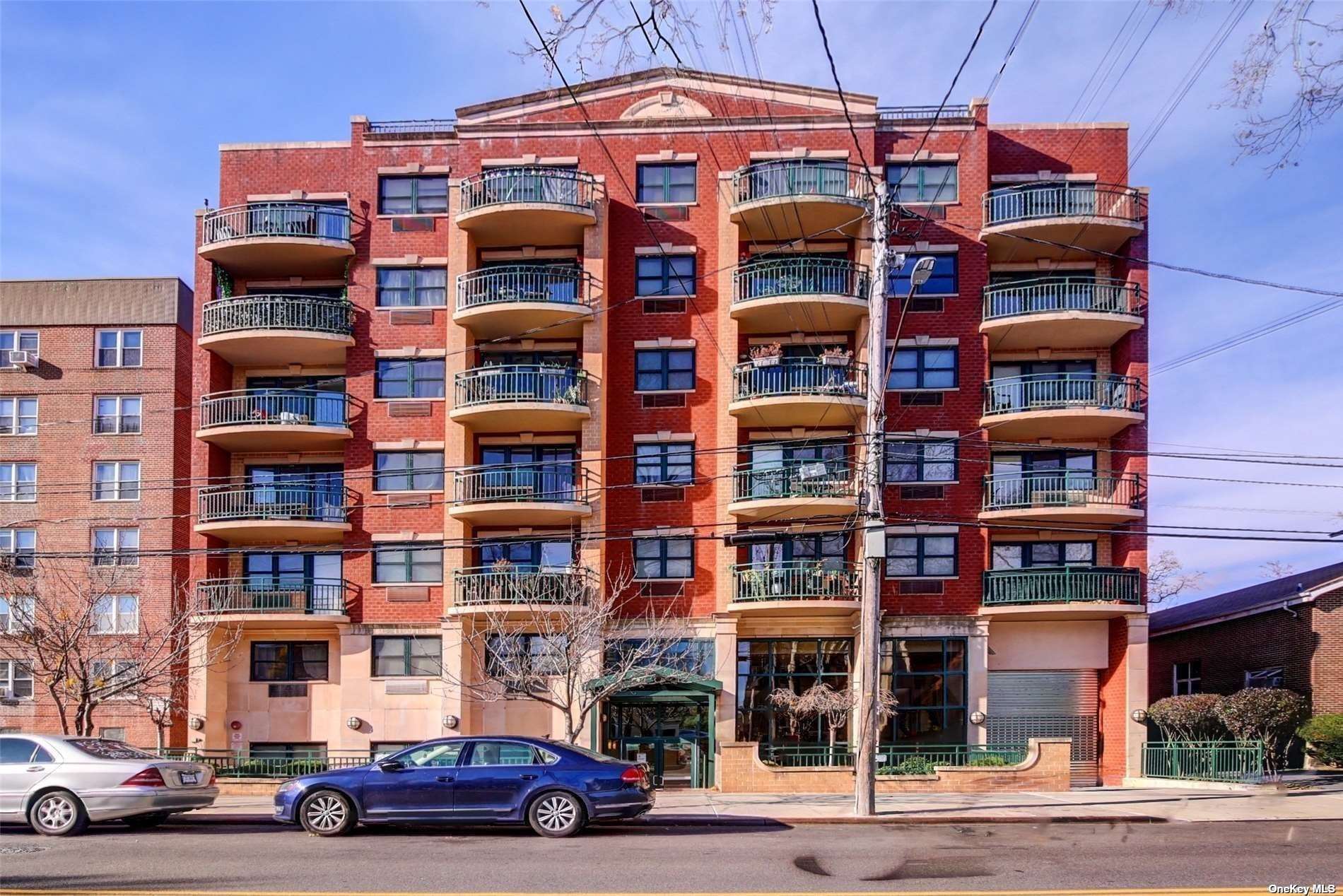 a front view of a building with lot of windows