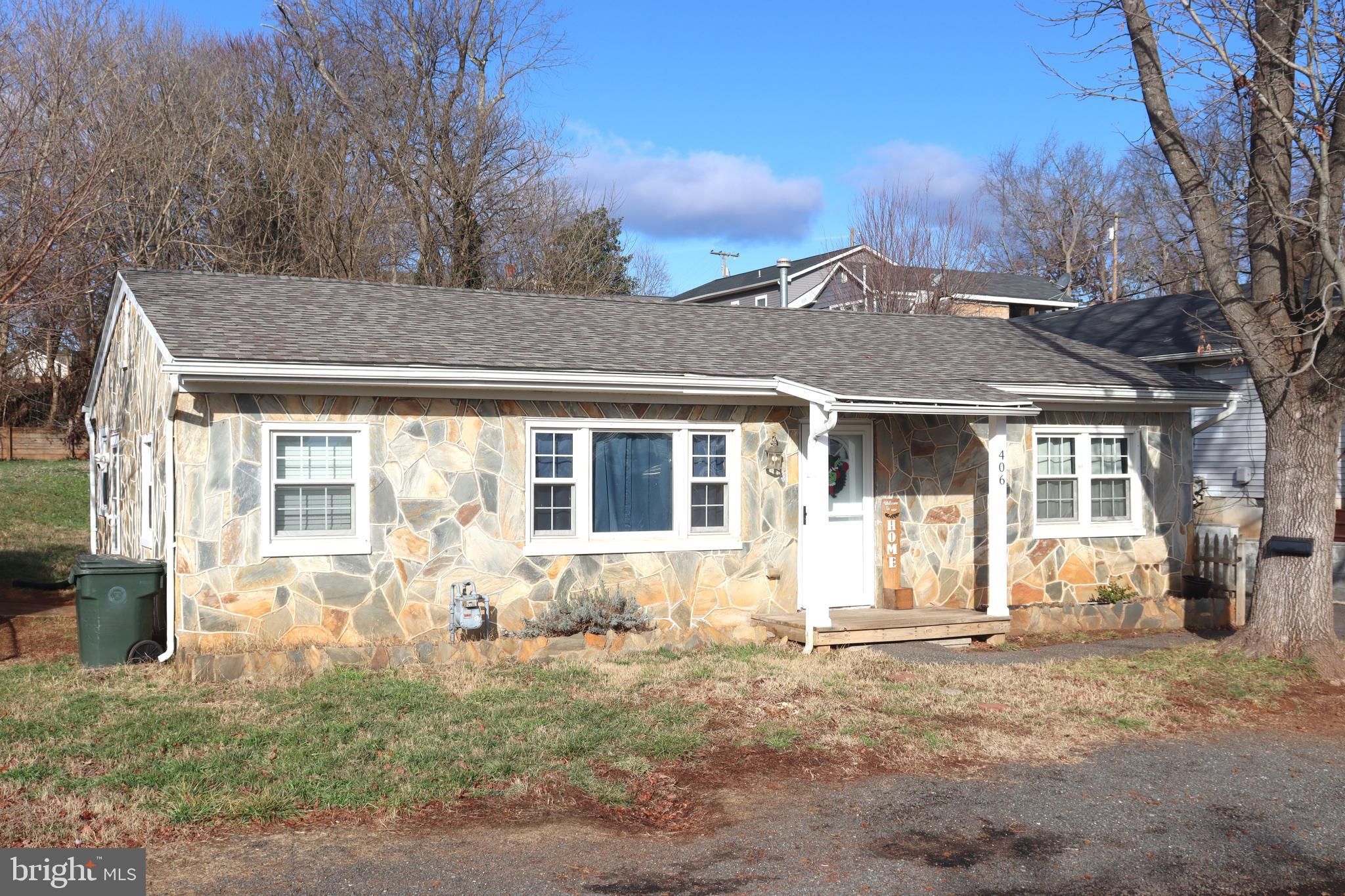 Stone exterior home facing Monticello Ave.