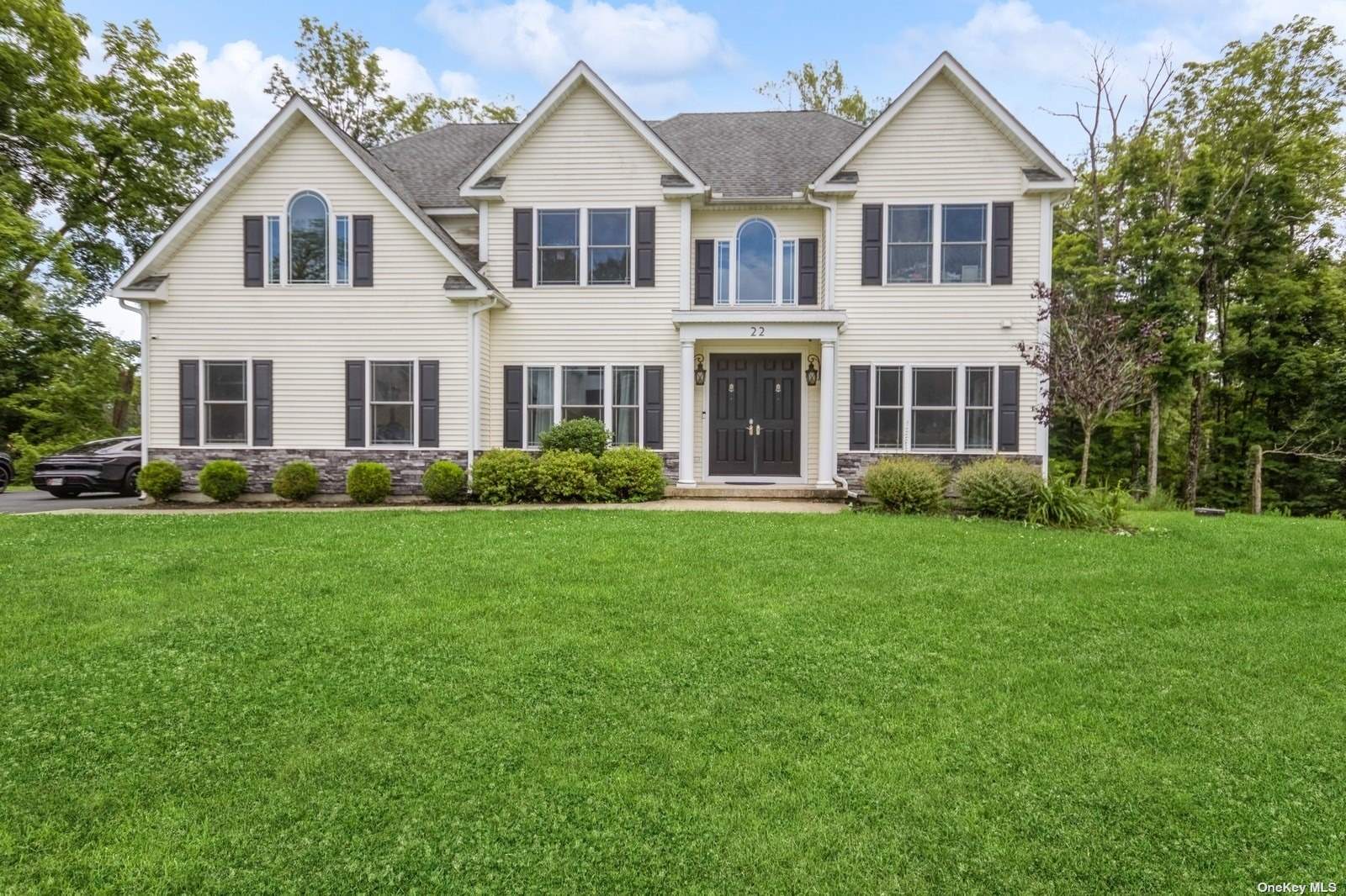 a front view of a house with a yard