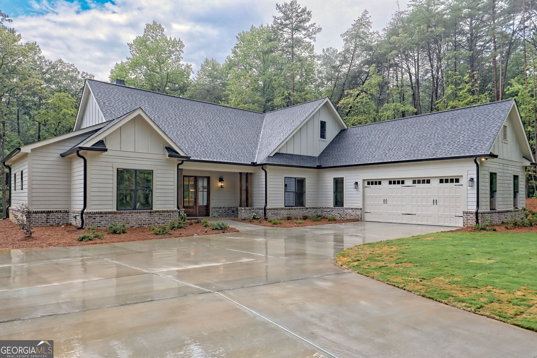 a front view of a house with garden