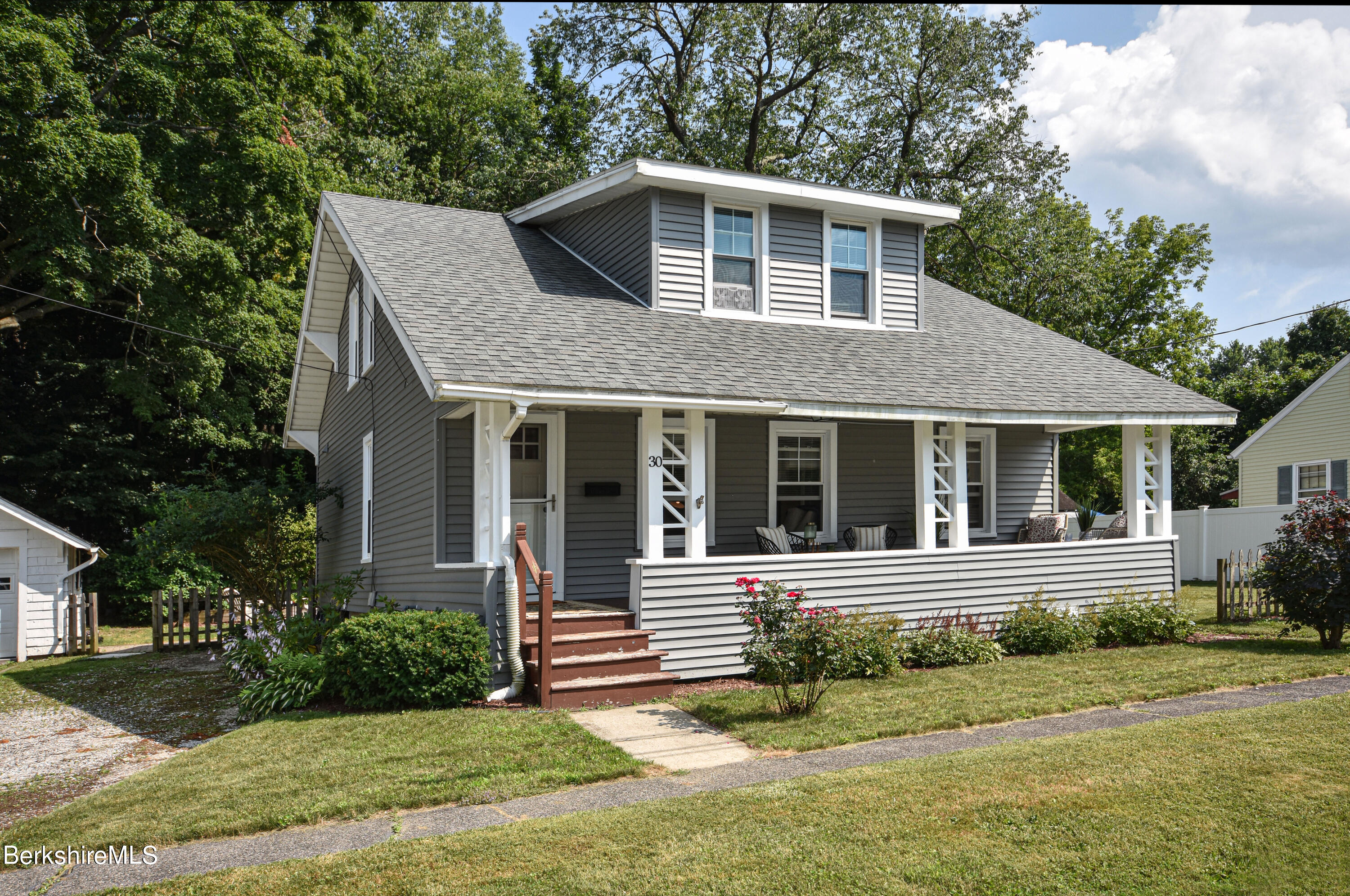 front view of a house with a yard