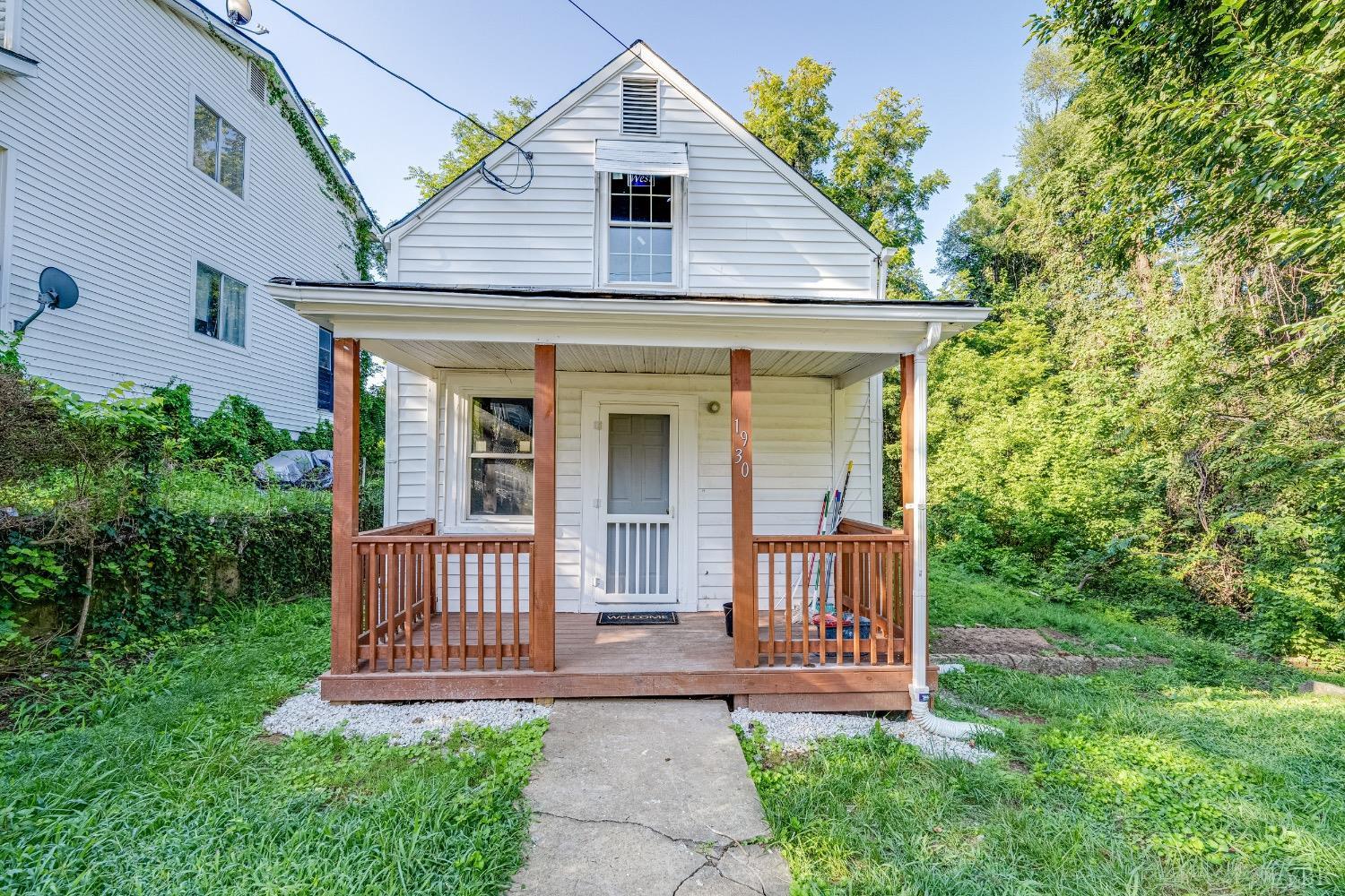 a view of a house with a yard and plants