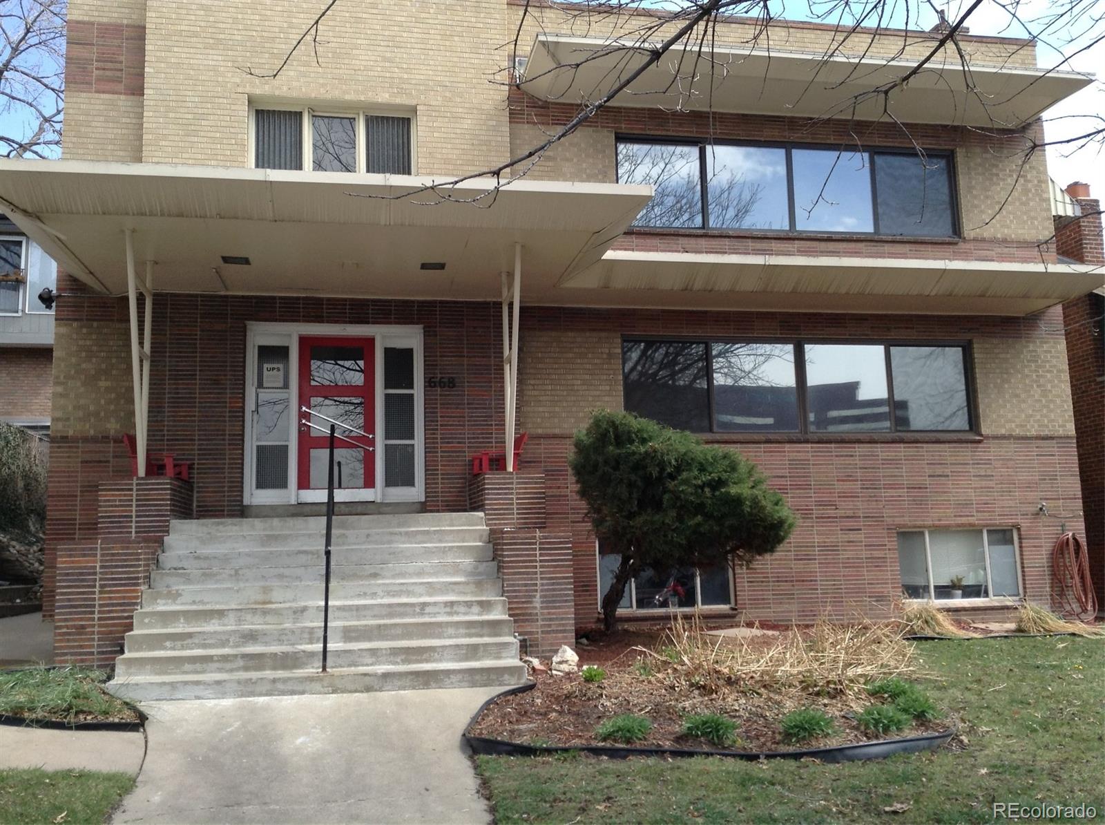 a front view of a house with parking