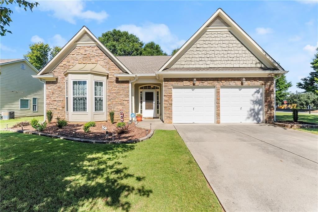 a front view of a house with a yard